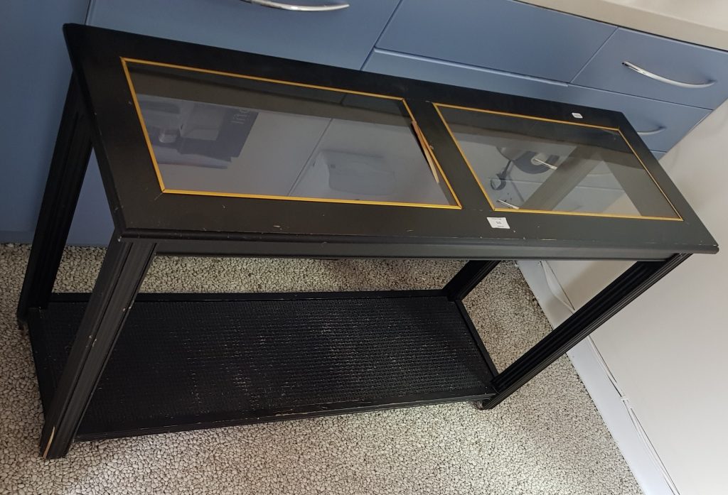 This glass side table will be upcycled, hopefully in black and gold